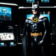 Michael Keaton's Batman stands surrounded by images of Jack Nicholson's Joker in the Bat Cave.